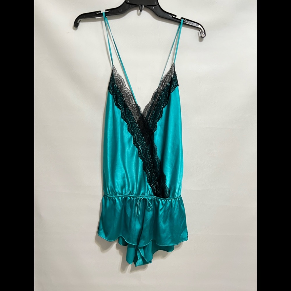 Victoria’s Secret Romper new condition. SZ M black lace a turquoise color